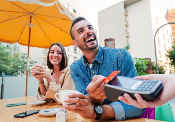 Man using his Members Choice debit card to pay for lunch