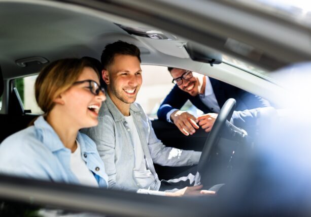 Professional,Car,Salesman,Excitedly,Showcases,Sleek,New,Vehicle,To,Young