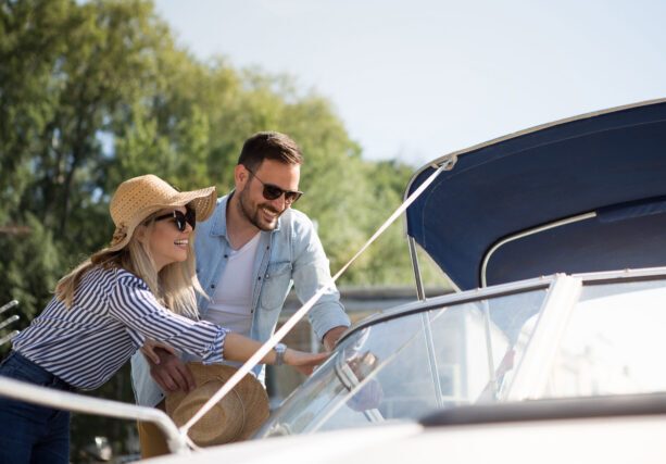 A,Beautiful,Young,Couple,Watches,A,Motor,Boat,That,They