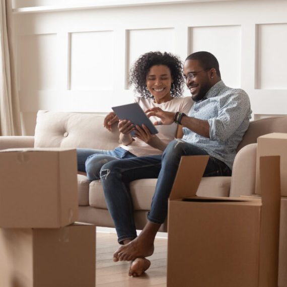 Happy,Young,African,Couple,Use,Digital,Tablet,Discuss,Interior,Design