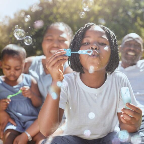 Happy,,Nature,And,Black,Family,Blowing,Bubbles,While,Playing,,Bonding