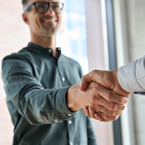 Two,Happy,Diverse,Professional,Business,Men,Executive,Leaders,Shaking,Hands
