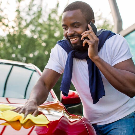 Washing,Car,Outdoor,,Self,Service,Station.,Young,Busy,African,Man